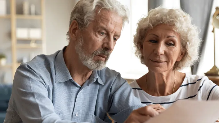 Man and woman looking at paperwork.