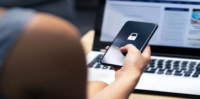 A woman locks her cellphone.